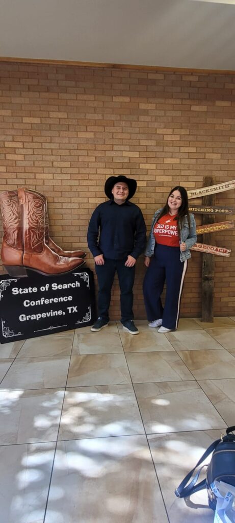 November at State of Search, Texas: Izzy and Filip are pictured at the State of Search conference in Texas, exemplifying their engagement and active participation in the industry event, with the vibrant conference atmosphere and branding in the background.